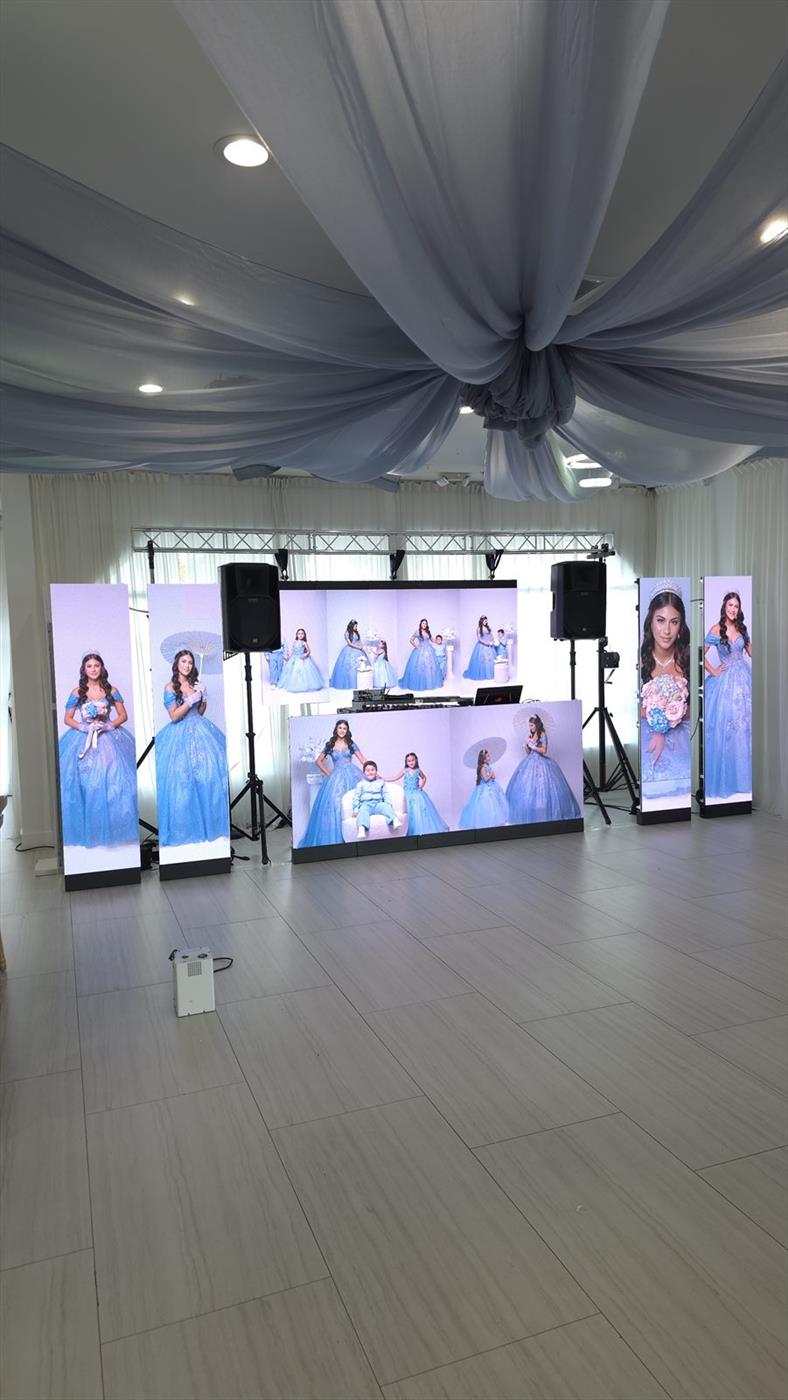 A stepped arrangement of LED video panels running portrait content at a quinceanera